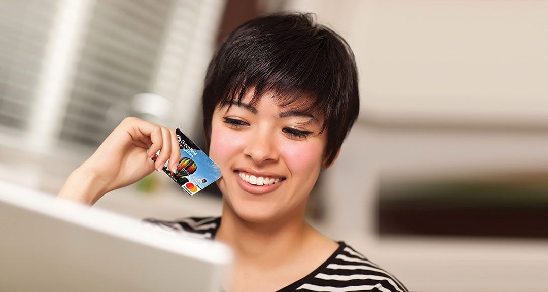 A woman making a debit or credit card purchase
