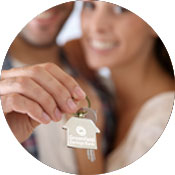a couple holding keys to a new home
