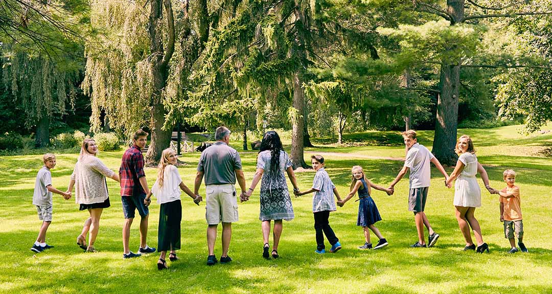 a group of people holding hands