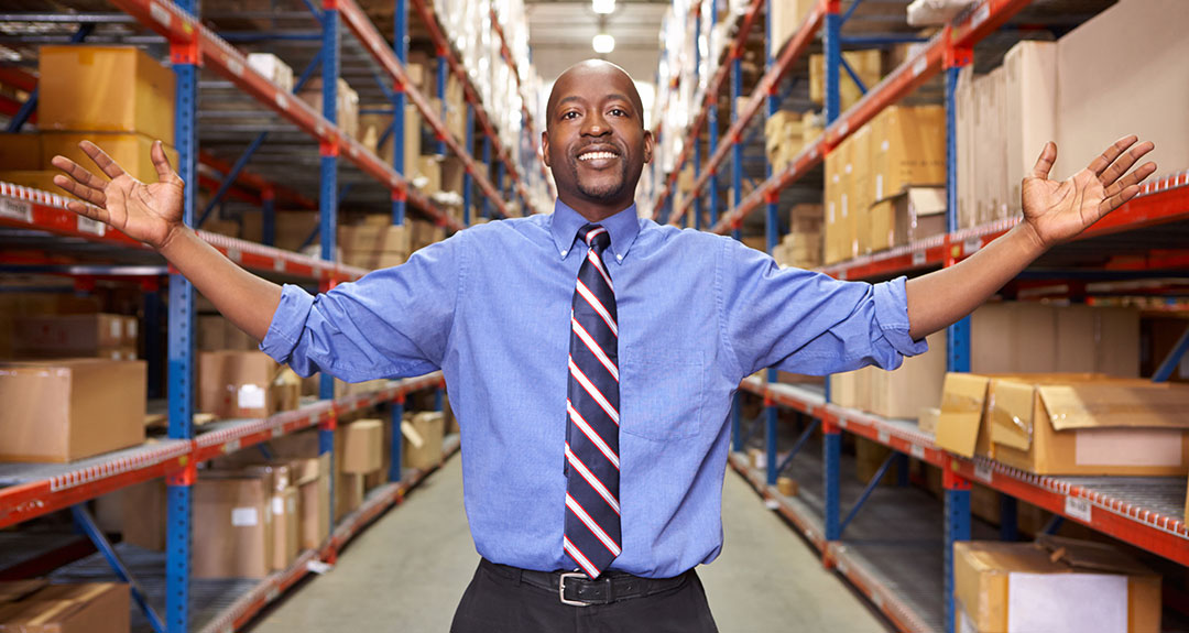 a man standing in a warehouse