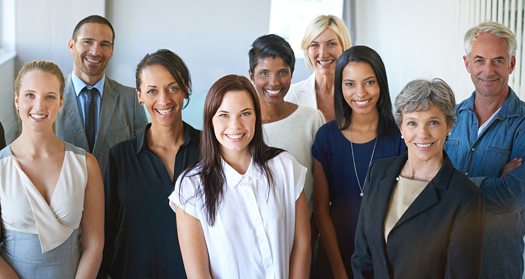 a group of business people smiling