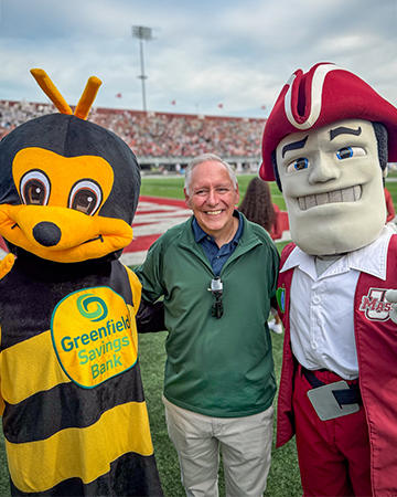 photo of the GSB bee mascot with our President and CEO Peter Albero and the UMass Minuteman mascot