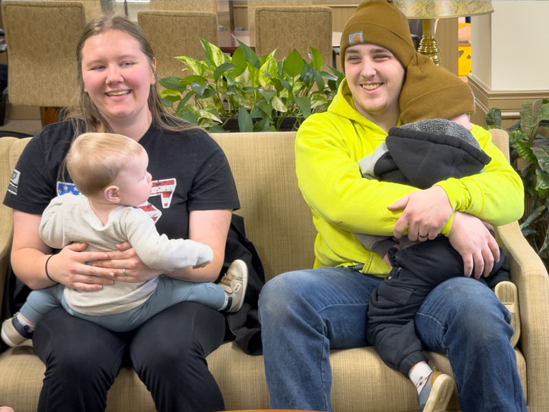 photo of the Bobala Family sitting on a couch
