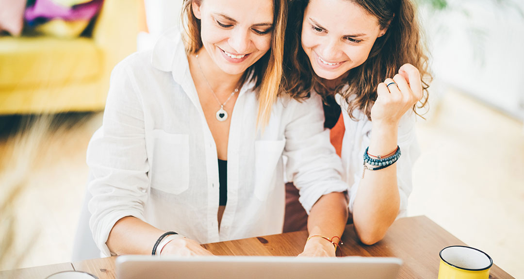 Two ladies working on a laptop