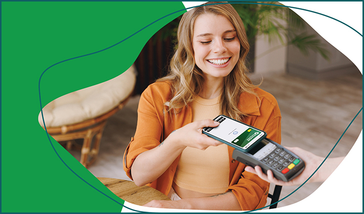 New product blog image. This is a photo of a green freeform element, and over that green element is another element that contains the photo of a young blonde woman using her phone/GSB debit card to pay for something.