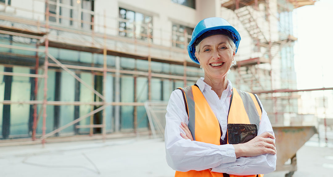 a woman wearing a blue hardhat