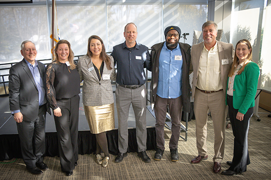 Group photo that includes Tom Meshako, Peter Albero, Tara Brewster, Seth, and Jen English.