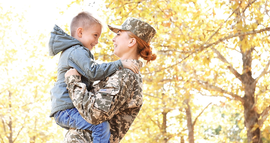 a veteran holding her son